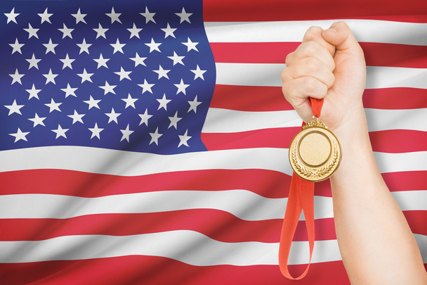 Medal in hand with flag on background - United States of America - Valokuva, kuva
