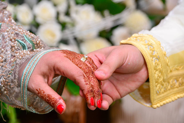 picture of man and woman with wedding ring.moroccan wedding.Wedding henna - Foto, afbeelding