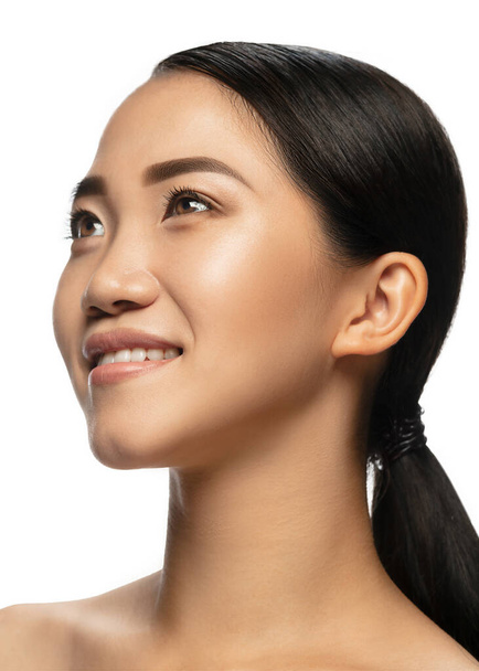 Portrait of beautiful asian woman isolated on white studio background. Beauty, fashion, skincare, cosmetics concept. - Photo, image