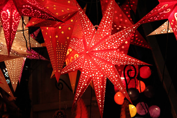 A closeup shot of bright red star lights - Фото, изображение