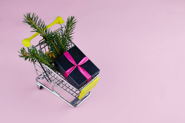 Gift on a pink background. Flat lay, top view, copy space. Christmas or new year's composition. - Foto, imagen