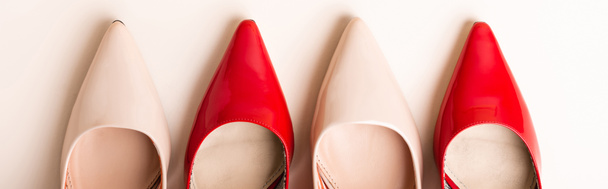 top view of leather heeled shoes on beige background, banner - 写真・画像