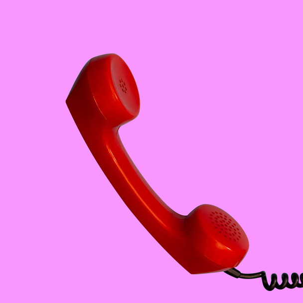Handset of authentic red retro rotary telephone isolated on pink - Photo, Image