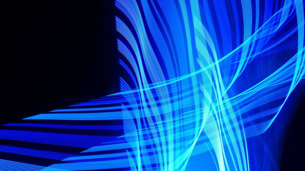 The texture of blue layers on black background, bright threads, gradual light trails, virtual networks, and spatial structures - Foto, imagen