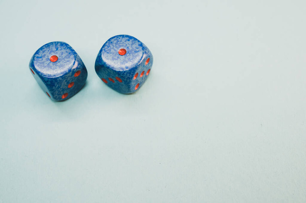 A high angle shot of blue dice isolated on a gray background - Fotografie, Obrázek