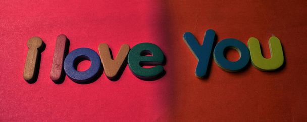 I love you card on red background. I love you concept. Colored letter spelling the words I Love You. - Foto, Bild