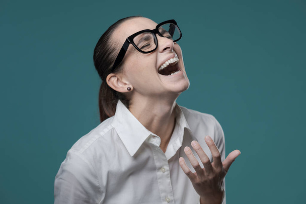 Cheerful woman laughing out loud and enjoying, expression and emotions concept - Photo, Image