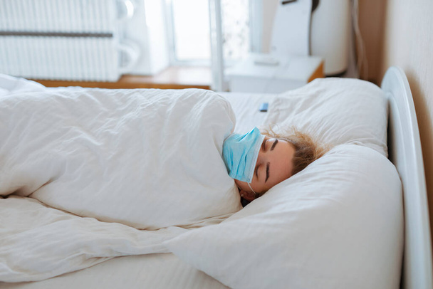 Woman sleep with surgical mask, coronavirus protection, covid-19 concept - Foto, Imagem