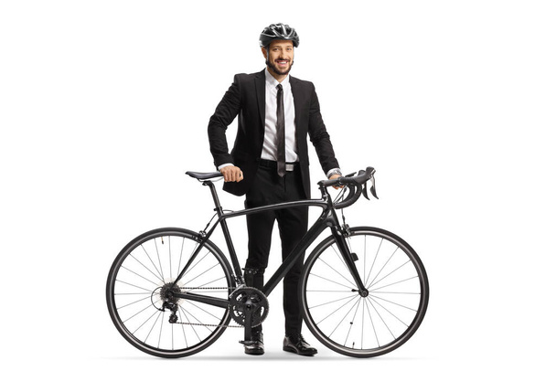 Businessman with a helmet standing next to his bicycle isolated on white background - Foto, immagini