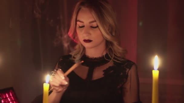 Female fortune teller lights magic incense for paranormal ritual - Footage, Video
