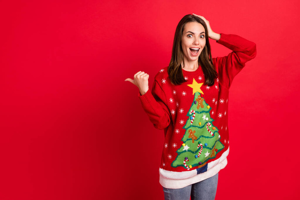 Portrait of her she nice-looking attractive pretty amazed cheerful cheery girl demonstrating newyear copy space wow cool offer winter isolated bright vivid shine vibrant red color background - Fotoğraf, Görsel