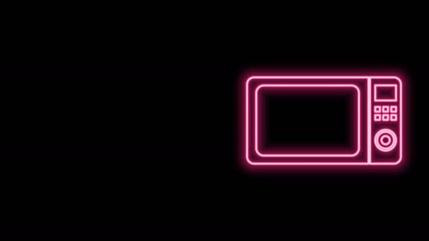 Gloeiende neon lijn Magnetron pictogram geïsoleerd op zwarte achtergrond. Huishoudapparaten icon.4K Video motion grafische animatie - Video