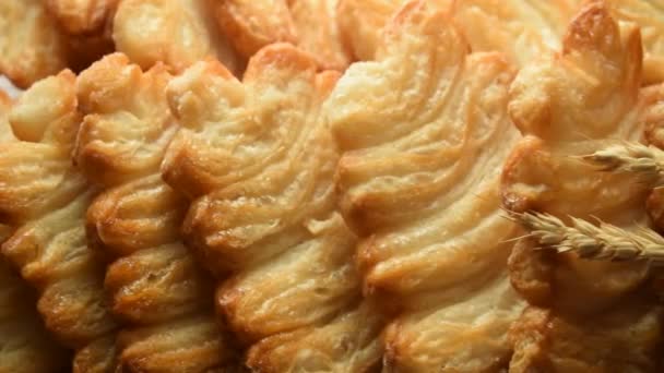Close up on puff pastry desserts with wheat ears. - Footage, Video