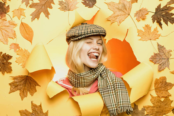 Beautiful girl with background board for Copyspace. Autumn mood and the weather are warm and sunny and rain is possible. Autumn discounts on lingerie. Sale of womens panties. Woman holding gold leaf. - Fotoğraf, Görsel
