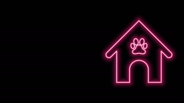 Glowing neon line Dog house and paw print pet icon isolated on black background. Dog kennel. 4K Video motion graphic animation - Footage, Video