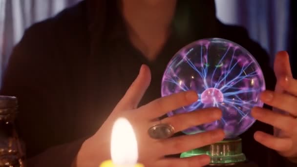 SIde view of male fortune teller casts a spells and performs ritual with crystal ball - Footage, Video