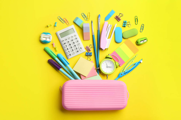 Flat lay composition with school stationery on yellow background. Back to school - Fotoğraf, Görsel