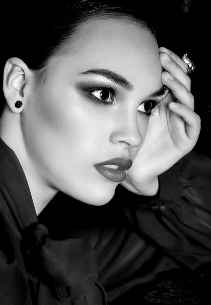 Young woman with makeup and with jewelry - Foto, imagen