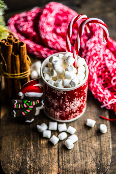 Christmas holiday flatlay with evergreen xmas tree and marshmallow on wooden background with copy space - Photo, Image