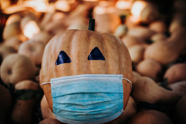 halloween 2020 pumpkin with a mask due to the covid 19 , coronavirus - Photo, Image