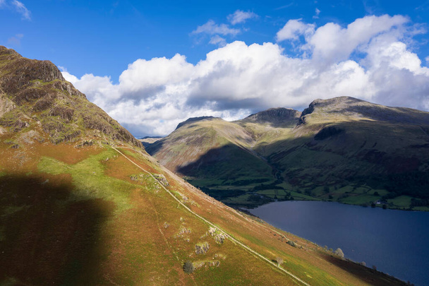 Stunning high point of view from flying drone over Lake District landscape in late Summer, in Wast Water valley with mountain views - Photo, Image