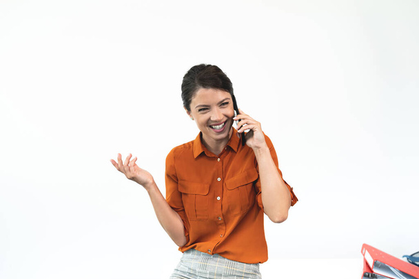 Cheerful businesswoman talking on mobile phone - Photo, image