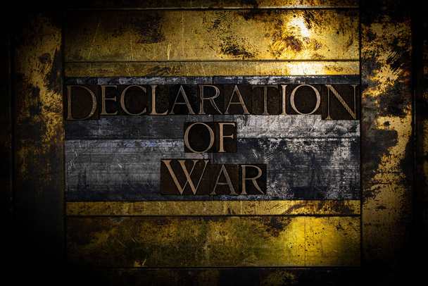 Declaration of War text message on textured grunge copper and vintage gold background - Photo, Image
