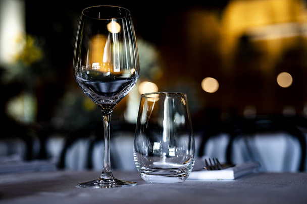 Luxury table settings for fine dining with and glassware, beautiful blurred  background. For events, weddings.  props for weddings, birthdays, and celebration. Wedding, restaurant, xmas 2020, 2021 - Foto, immagini