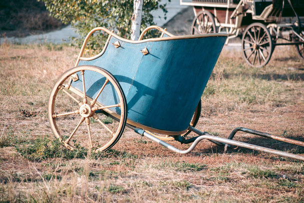 Blue ancient chariot with yellow wheels - Photo, Image