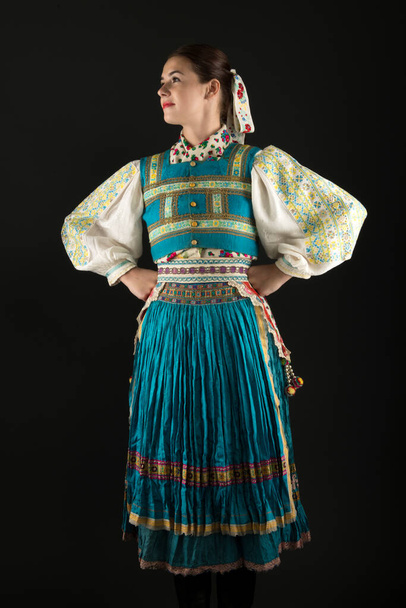 Young beautiful girl in slovak folk dress. Slovak folklore.  - Photo, image