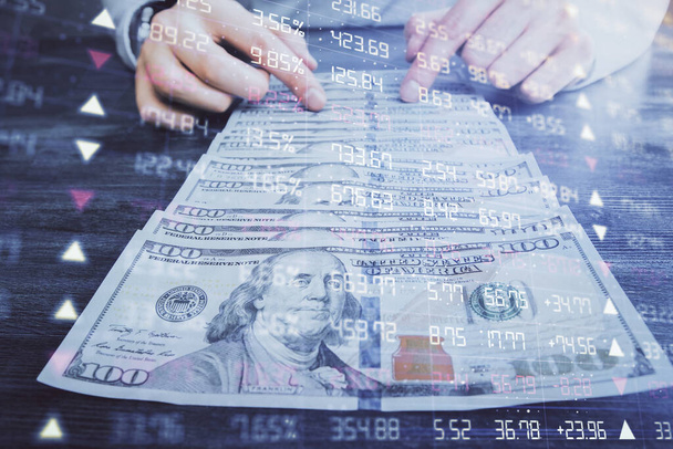 Multi exposure of forex graph drawing hologram and USA dollars bills and man hands. Technical Analysis concept. - Фото, изображение