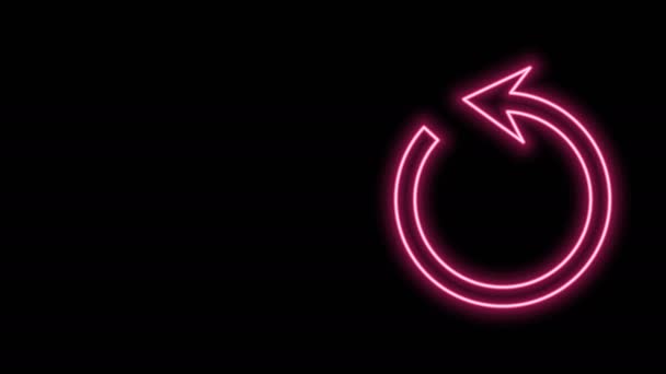 Gloeiende neon lijn Vernieuwen pictogram geïsoleerd op zwarte achtergrond. Herlaad het symbool. Rotatie pijl in een cirkel teken. 4K Video motion grafische animatie - Video