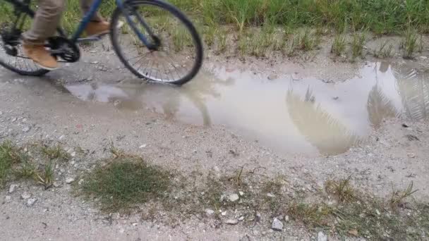 footage of the bicycle riding over the puddlle after rain. - Footage, Video