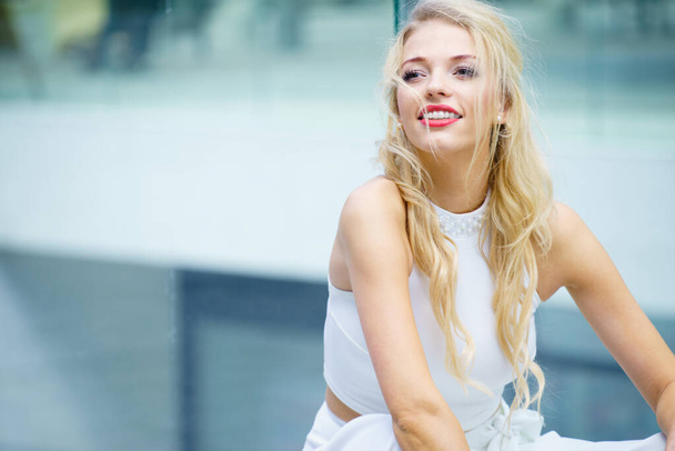 Happy cheerful elegant fashionable blonde woman outdoor. Female having great positive smile having red lipstick - Foto, Imagen