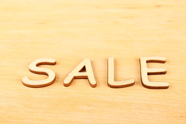 Wooden letters "sale" - Фото, изображение