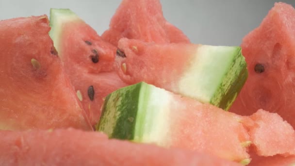 Pieces of watermelon are on the plate. Close-up, macro shooting. The camera moves smoothly - Footage, Video