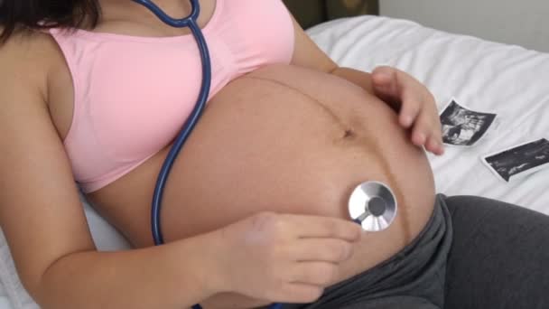 Happy pregnant woman and expecting baby at home. - Footage, Video