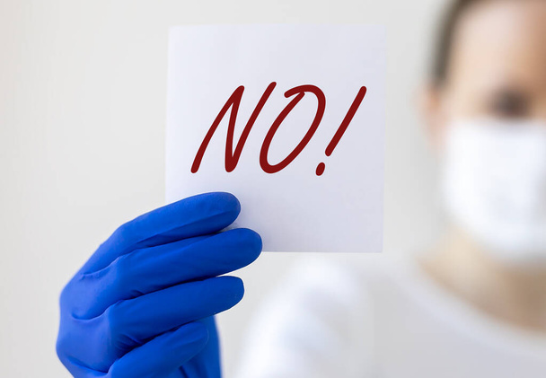no sign word in doctor hands. Negative answer concept. No risk, no illness, no virus. - Фото, изображение