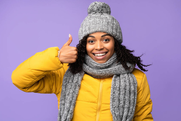 I Like It. African American Woman Gesturing Thumbs-Up, Purple Background - Photo, Image