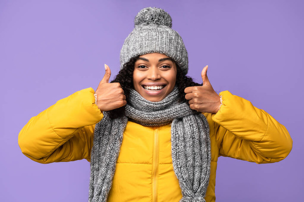 Black Lady Gesturing Thumbs Up With Both Hands, Purple Background - Photo, Image