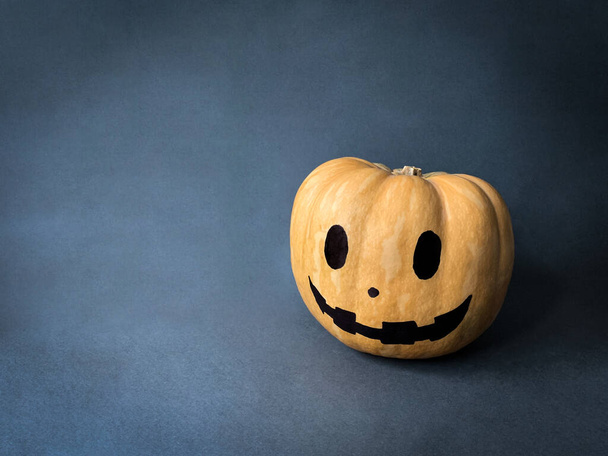 Halloween pumpkin head jack lantern on dark background with copy space - Photo, Image