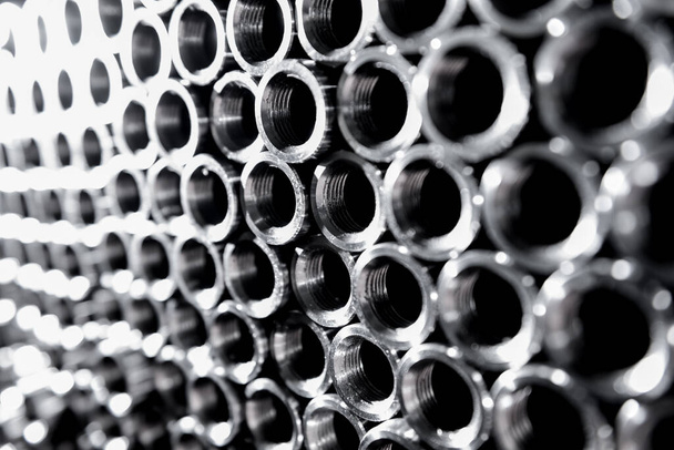 Abstract background of steel pipes stacked on a pallet - Фото, зображення