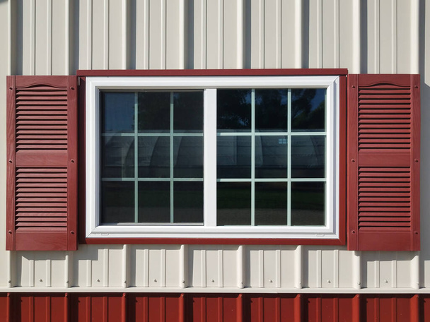 Close up of a barn window with red shutters - Photo, Image
