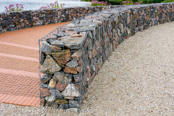 environmental object, gabion fence wall from steel mesh with stones - Photo, Image