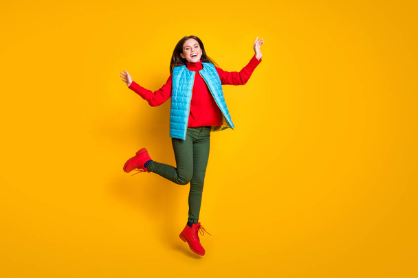 Full body photo of excited carefree girl jump enjoy autumn fall weekend holiday wear red season clothes isolated over bright color background - Foto, Imagem