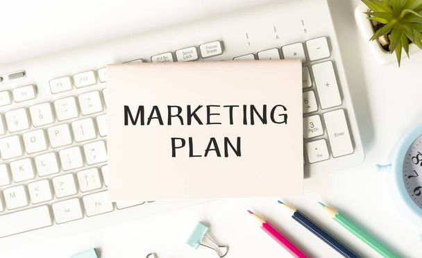 Notebook with Toolls and Notes about Marketing Plan - Φωτογραφία, εικόνα