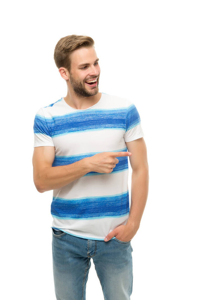 happy guy has groomed hair isolated on white. human emotions. sexy boy with trendy hairstyle wear shirt. handsome unshaven man with bristle pointing finger. male summer casual fashion style - Photo, Image