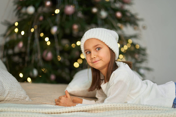 Happy childhood, Christmas magic fairy tale. Little girl waiting for Christmas and holiday gifts - Fotoğraf, Görsel