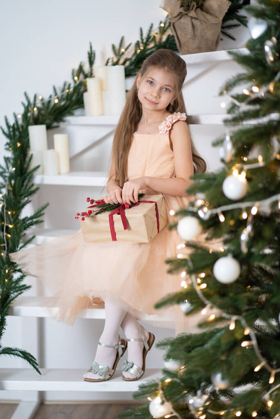Little girl in princess dress celebrates christmas. Christmas magic fairy tale. Happy childhood. - Valokuva, kuva