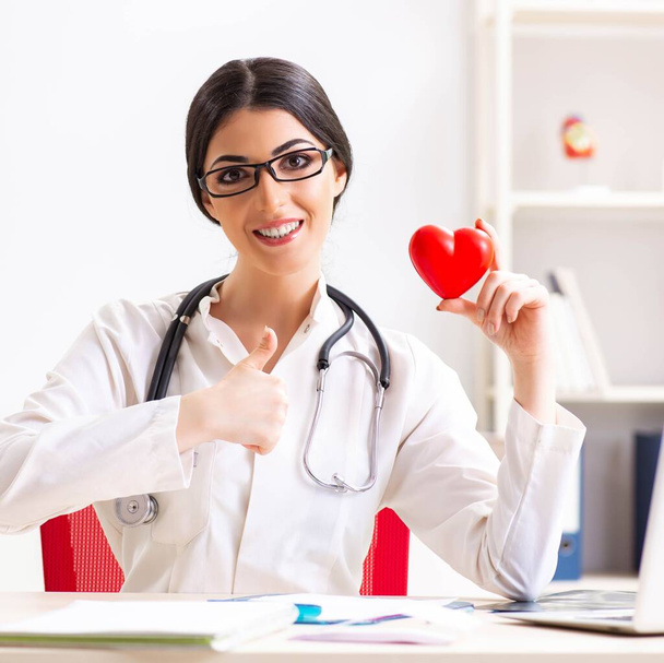 Young doctor in heart care concept - Photo, Image